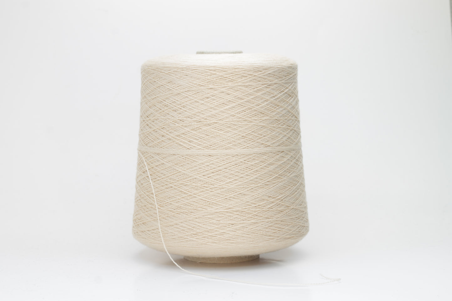 Close-up of luxurious Beige Merino wool yarn, two-ply twist with a soft, subtle sheen, and fine, consistent thread structure.