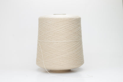 Close-up of luxurious Beige Merino wool yarn, two-ply twist with a soft, subtle sheen, and fine, consistent thread structure.