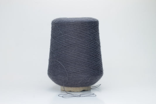 Rich Gray 2-ply Alpaca Merino yarn, softly twisted with a gentle halo and subtle sheen, showcasing its deep, luxurious color saturation.