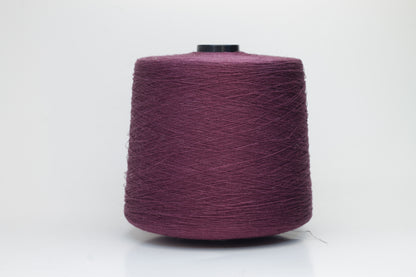 Fine, single-ply linen yarn in a Cardinal. Reveals a crisp texture and subtle natural sheen, typical of pure linen fiber.