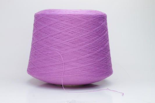 Close-up image showcasing a vibrant purple 100% merino yarn skein with a slight twist, revealing the fine ply structure and rich color depth; the fiber appears fluffy and soft.