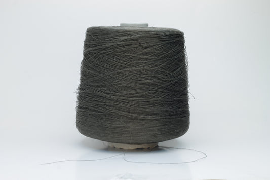 Skein of finely spun yarn, a muted artichoke green. Its smooth, even twist reveals the crisp texture of linen with a subtle, natural sheen. Low fluff, clean look.