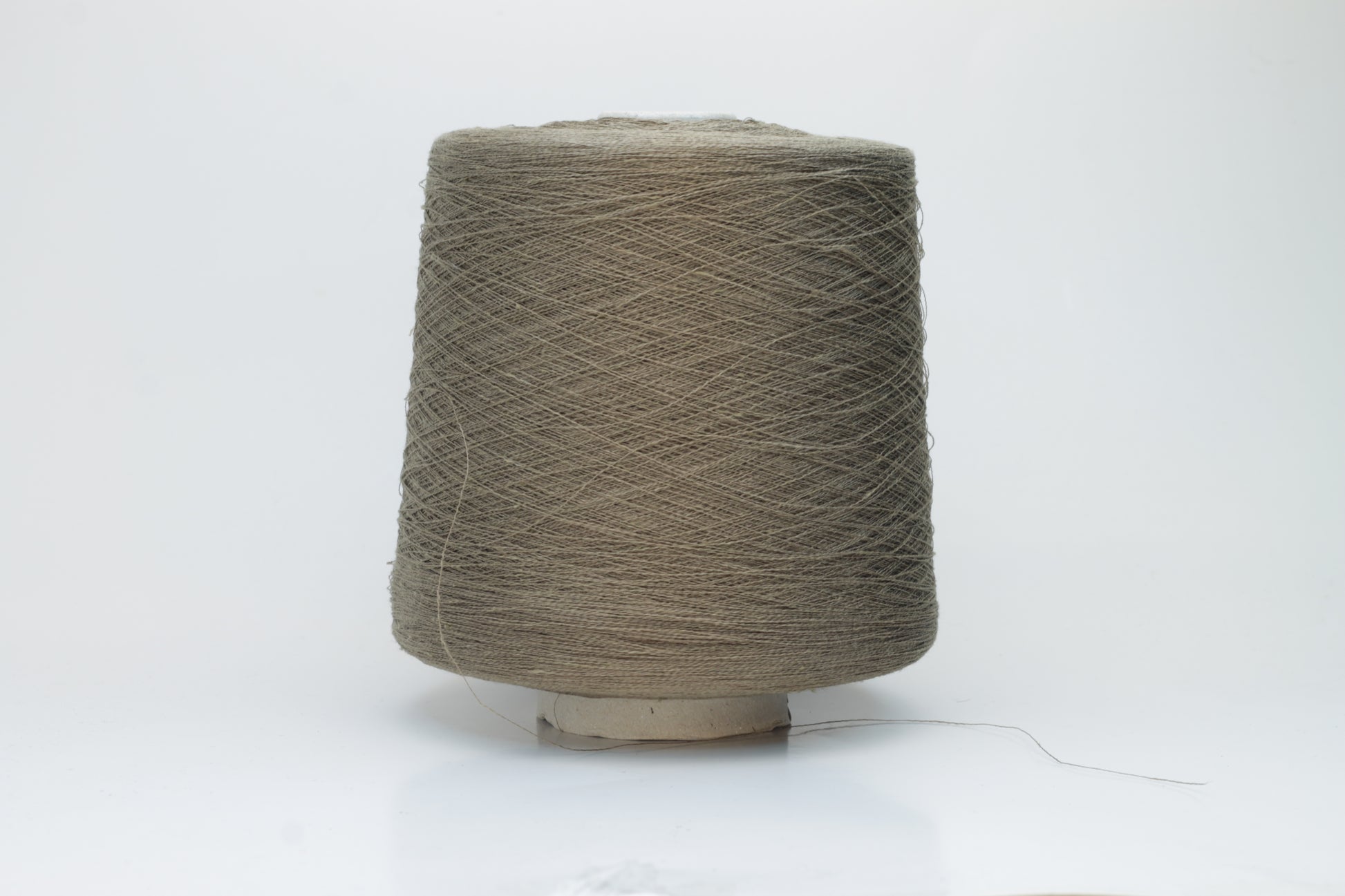 A single-ply yarn in a rich, warm 'Castoro' earthy brown. It has a slightly textured, natural linen look with a subtle sheen, wound loosely.