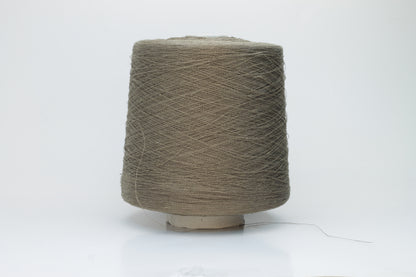 A single-ply yarn in a rich, warm 'Castoro' earthy brown. It has a slightly textured, natural linen look with a subtle sheen, wound loosely.