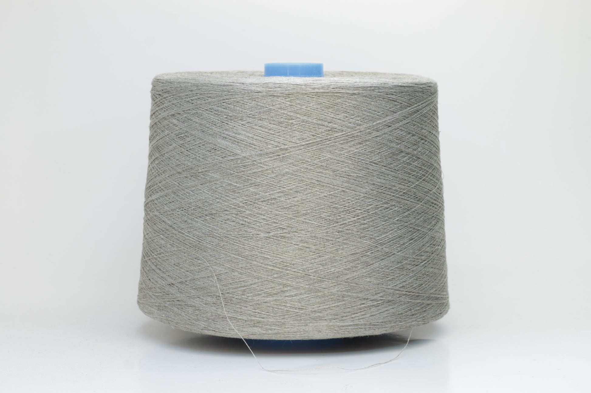 Fine, single-ply linen yarn in a rich charcoal gray. Reveals a crisp texture and subtle natural sheen, typical of pure linen fiber.