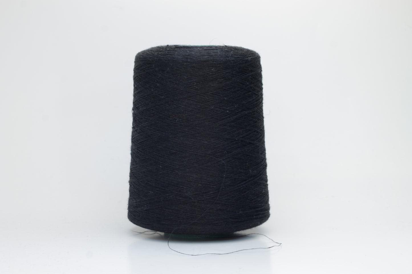 Fine, single-ply linen yarn in a Black. Reveals a crisp texture and subtle natural sheen, typical of pure linen fiber.