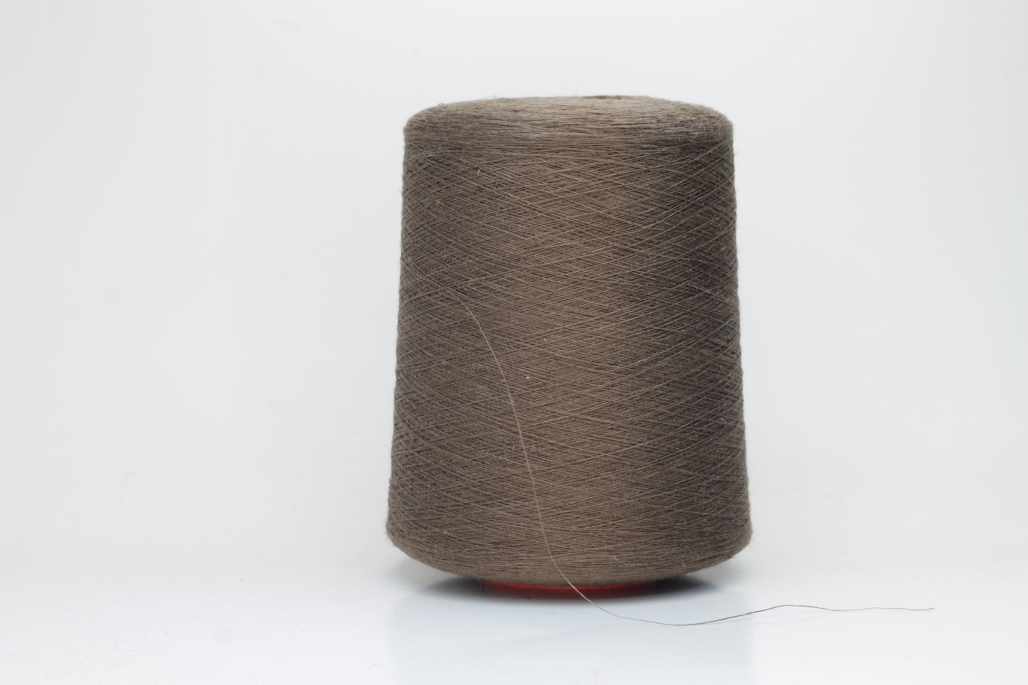 Fine, single-ply linen yarn in a rich Brown. Reveals a crisp texture and subtle natural sheen, typical of pure linen fiber.