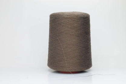 Fine, single-ply linen yarn in a rich Brown. Reveals a crisp texture and subtle natural sheen, typical of pure linen fiber.