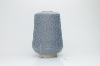 Denim Blue 2-ply Alpaca Merino yarn, softly twisted with a gentle halo and subtle sheen, showcasing its deep, luxurious color saturation.