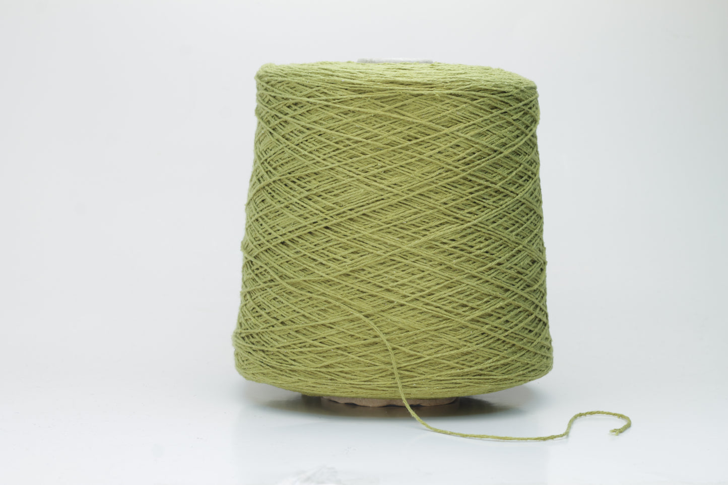 Close-up view of the Silk Bourette 100% yarn in Olive color, showcasing its exceptionally fine ply twist and soft sheen – a luxurious texture perfect for knitting or weaving.