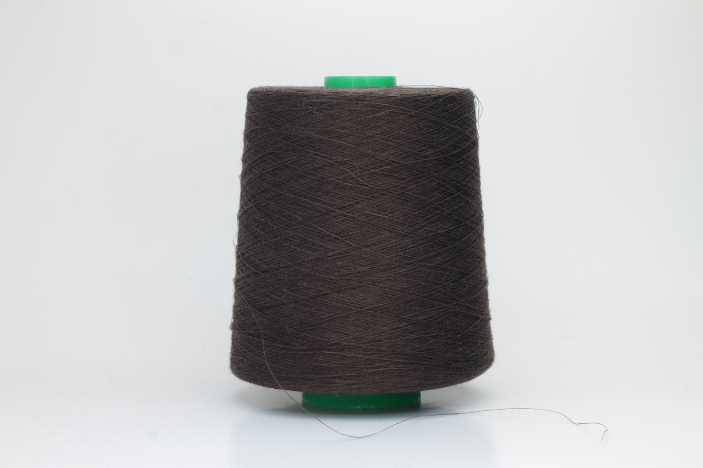 Fine, single-ply linen yarn in a rich Brown. Reveals a crisp texture and subtle natural sheen, typical of pure linen fiber.