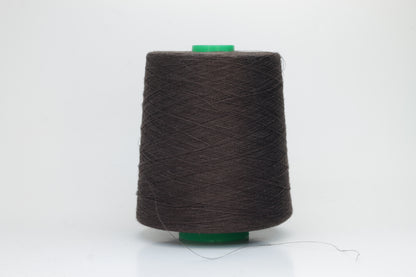 Fine, single-ply linen yarn in a rich Brown. Reveals a crisp texture and subtle natural sheen, typical of pure linen fiber.