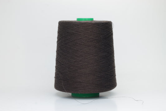 Fine, single-ply linen yarn in a rich Brown. Reveals a crisp texture and subtle natural sheen, typical of pure linen fiber.