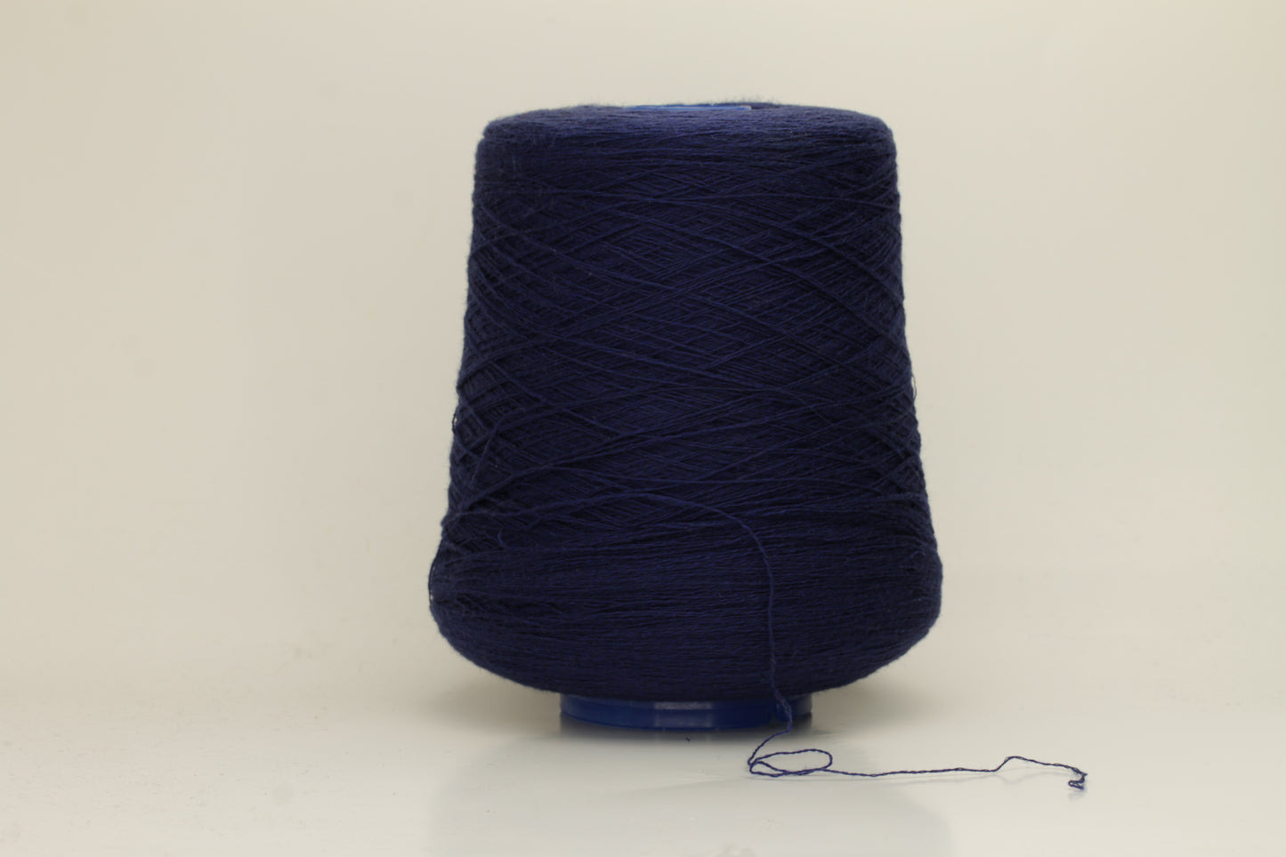 Rich, White 2-ply yarn with a fine, smooth twist; exhibits a subtle sheen and incredibly soft, uniform texture.