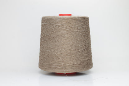 Fine, single-ply linen yarn in a rich Natural Taupe. Reveals a crisp texture and subtle natural sheen, typical of pure linen fiber.