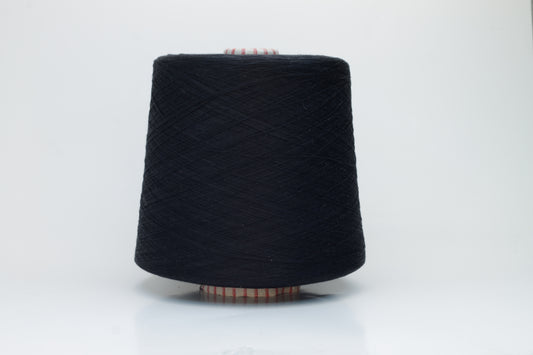Close-up of luxurious black 100% silk yarn, tightly plied with a smooth, high-luster surface reflecting light. It has a deep, true black color, wound evenly on a cone.
