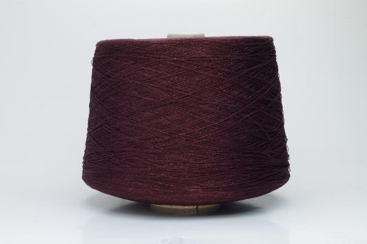 Close-up of a neatly wound cone of deep wine-red 2-ply linen yarn, exhibiting a subtle natural sheen and distinct crisp texture.