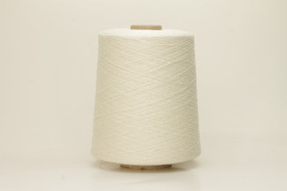 A tightly twisted single strand of luxurious deep royal blue silk yarn, reflecting light with a soft, natural sheen.