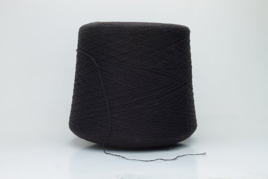 Close-up of a two-ply dark brown cashmere yarn, softly twisted with a subtle sheen, displaying its deep rich hue and delicate fuzziness, ready for luxury crafting.