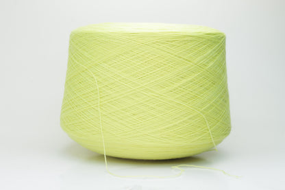 Close-up shot of a skein of ZEGNA Baruffa Merino 100% Cashwool yarn in Lemon color. The yarn exhibits a tight, twisted ply structure with a subtle sheen and a fluffy, inviting texture.
