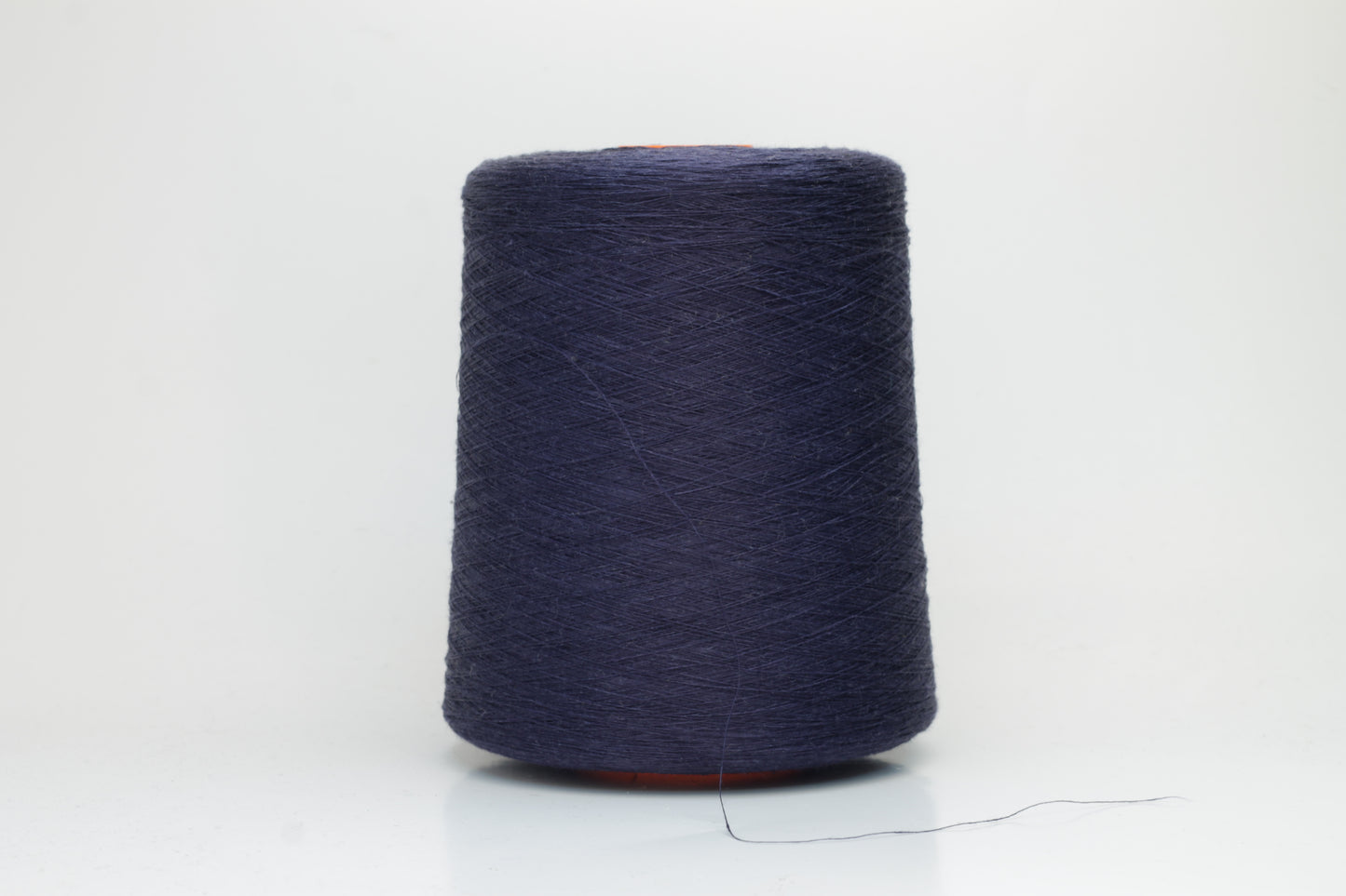Fine, single-ply linen yarn in a rich Blue Boy. Reveals a crisp texture and subtle natural sheen, typical of pure linen fiber.