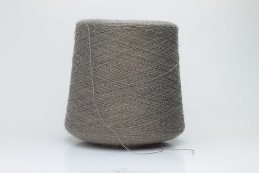 Close-up shot of Zegna Baruffa Merino 100% Cashwool Yarn in Taupe, showcasing a dense ply twist and fine thread structure with subtle sheen and a fluffy texture.