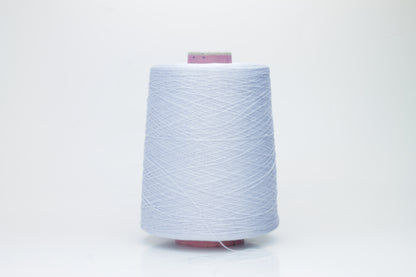 Close-up shot of light blue mulberry silk and viscose yarn, showing a tight, even ply twist with subtle sheen and fluffy texture.