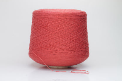 Close-up shot of vibrant red Zegna Baruffa Merino 100% Cashwool yarn, showcasing a tight 2/30 Nm ply twist and rich color depth, highlighting the wool's natural sheen and fluffy texture.