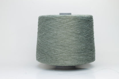 Fine, single-ply linen yarn in a rich Sage Green. Reveals a crisp texture and subtle natural sheen, typical of pure linen fiber.