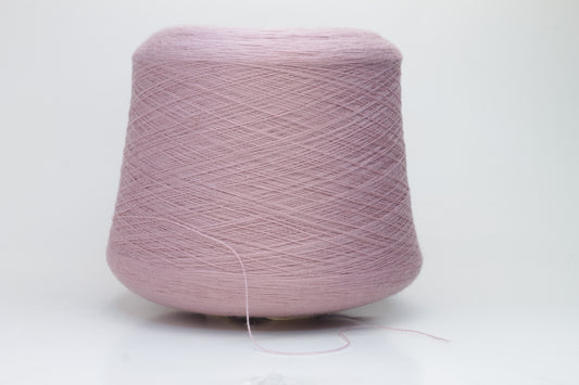 Close-up studio shot showcasing the 'Harmony 2' merino yarn in a rich 'Rosa' hue. The yarn exhibits a tight, twisted ply with an even thread structure, creating subtle sheen and a fluffy texture.