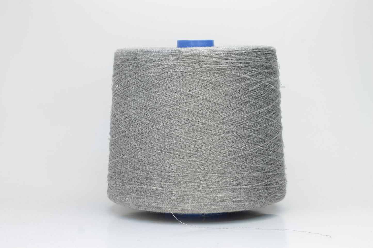 Fine, single-ply linen yarn in a rich charcoal gray. Reveals a crisp texture and subtle natural sheen, typical of pure linen fiber.