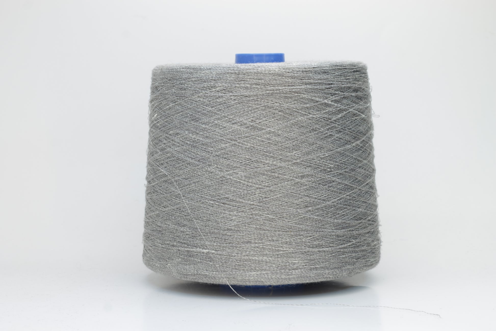 Fine, single-ply linen yarn in a rich charcoal gray. Reveals a crisp texture and subtle natural sheen, typical of pure linen fiber.