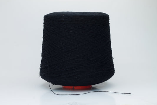 Close-up of a deep black, two-ply cashmere yarn, exhibiting a soft, even twist and a subtle, rich sheen under natural light, indicating its luxurious texture.