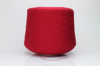 Close-up shot of vibrant red Zegna Baruffa Merino 100% Cashwool yarn, displaying a tight 2/30 Nm ply twist with deep color saturation and a slightly fluffy texture.