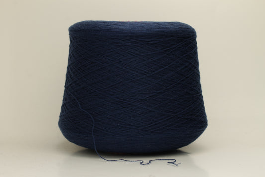 Close-up of a luxurious, soft dark blue 2-ply cashmere yarn, subtly twisted with a delicate sheen and rich, deep color saturation.