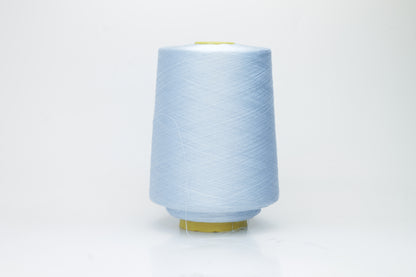 Close-up of radiant Azzurro blue silk yarn, featuring a finely spun, lustrous organzino thread with a pronounced, smooth sheen.