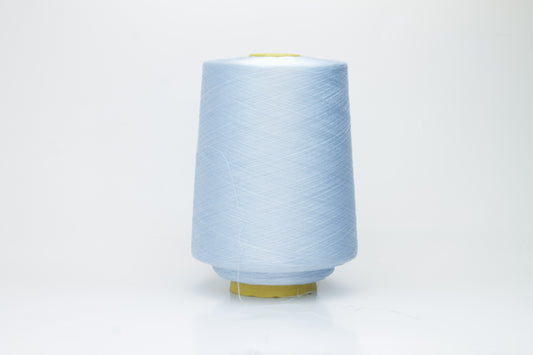 Close-up of radiant Azzurro blue silk yarn, featuring a finely spun, lustrous organzino thread with a pronounced, smooth sheen.