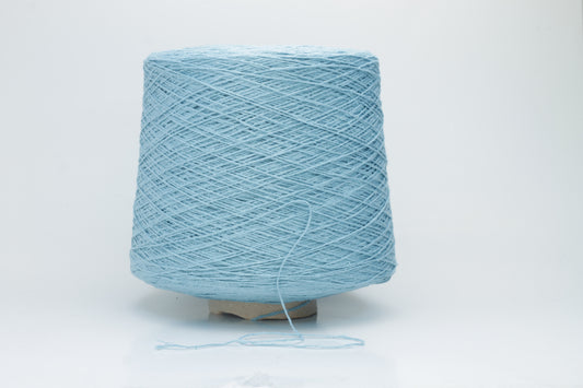 Close-up shot showcasing the shimmering, fluffy texture of the Coscata Silk Bourette yarn, with visible ply twists and a subtle sheen, highlighting its luxurious feel.