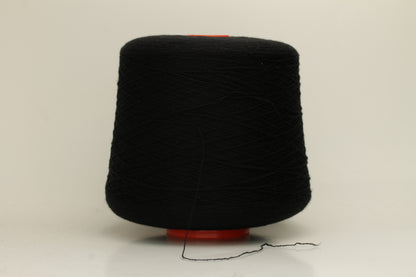 Rich, deep black 2-ply yarn with a fine, smooth twist; exhibits a subtle sheen and incredibly soft, uniform texture.