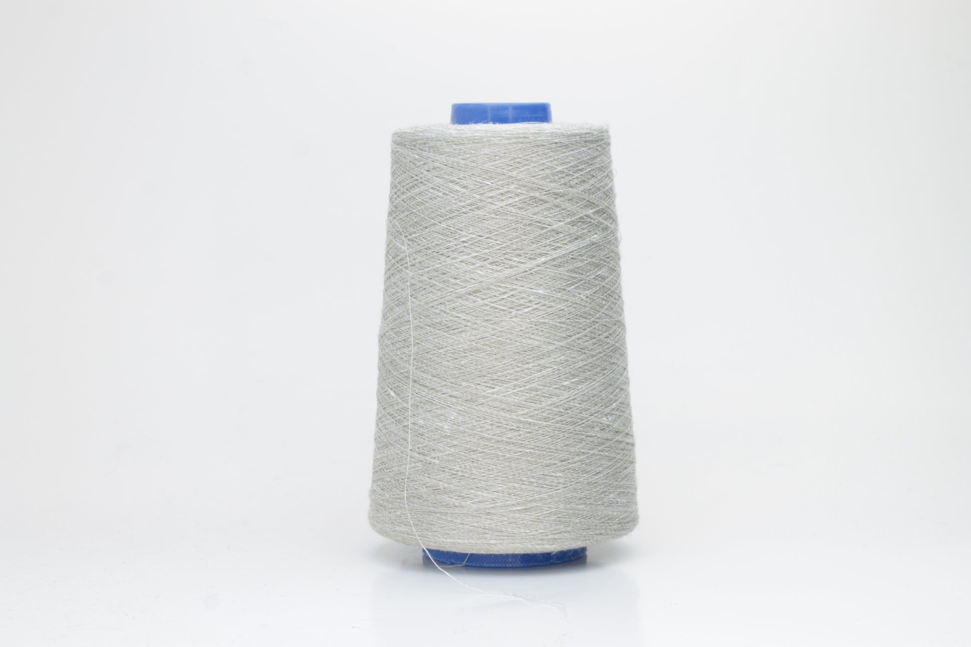 Fine, single-ply linen yarn in a rich Light Gray. Reveals a crisp texture and subtle natural sheen, typical of pure linen fiber.