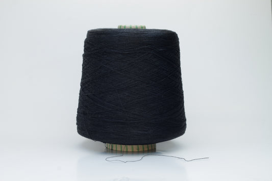 Spool of rich, deep black silk yarn, showcasing its fine, smooth plies and radiant, natural luster against a soft background.