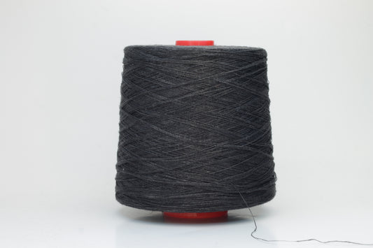 Fine, single-ply linen yarn in a rich Charcoal Black. Reveals a crisp texture and subtle natural sheen, typical of pure linen fiber.