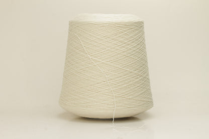 Close-up of a skein of pristine Ice White 100% cashmere yarn, showcasing its fine, evenly plied two-ply structure and delicate, soft halo.