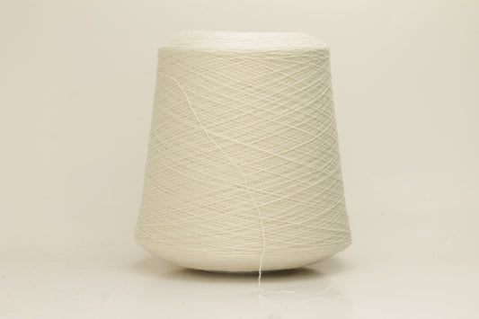 Close-up of a skein of pristine Ice White 100% cashmere yarn, showcasing its fine, evenly plied two-ply structure and delicate, soft halo.