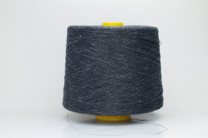 Fine, single-ply linen yarn in a rich Storm Gray. Reveals a crisp texture and subtle natural sheen, typical of pure linen fiber.