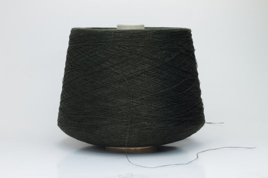 Two plies of earthy Cicoria brown linen yarn, tightly twisted with visible fibers, showcasing natural slubs and a subtle, sophisticated sheen.