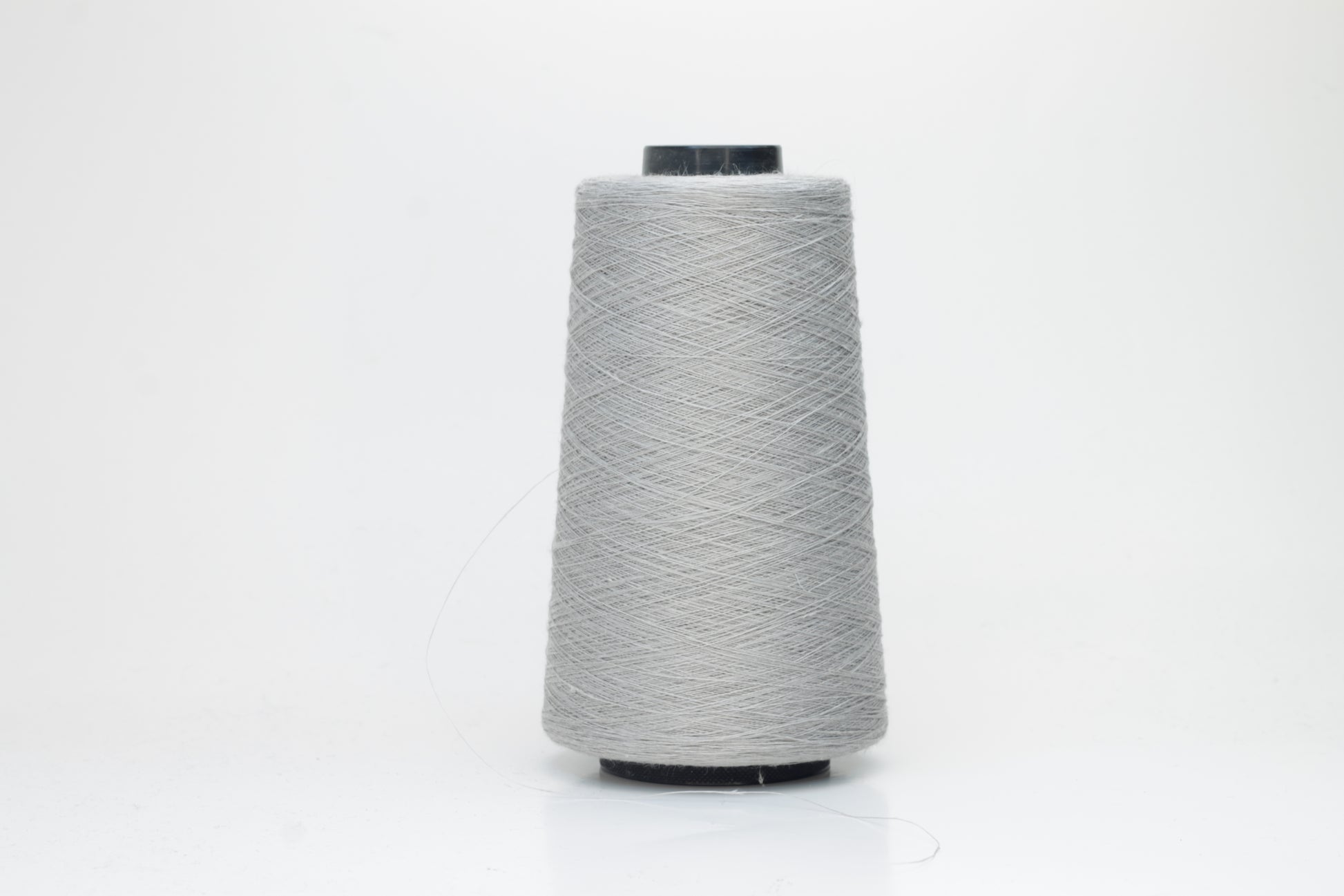 Fine, single-ply linen yarn in a rich Aluminum. Reveals a crisp texture and subtle natural sheen, typical of pure linen fiber.