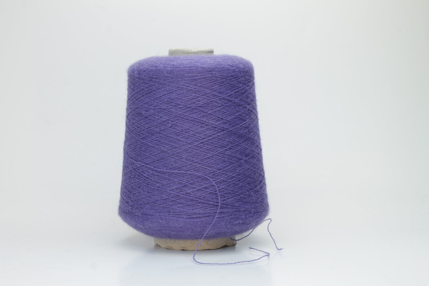 Rich purple 2-ply Alpaca Merino yarn, softly twisted with a gentle halo and subtle sheen, showcasing its deep, luxurious color saturation.