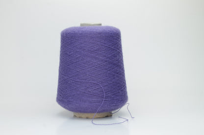 Rich purple 2-ply Alpaca Merino yarn, softly twisted with a gentle halo and subtle sheen, showcasing its deep, luxurious color saturation.