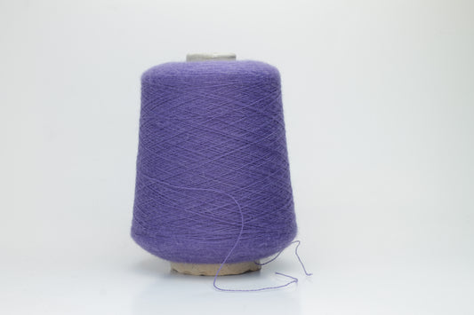 Rich purple 2-ply Alpaca Merino yarn, softly twisted with a gentle halo and subtle sheen, showcasing its deep, luxurious color saturation.